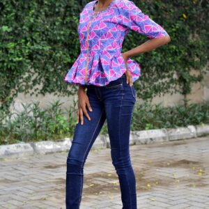 Ankara top design with rhinestones around the neck line and a golden zipper.At the bottom is a ruffle design that fits any pant or skirt.